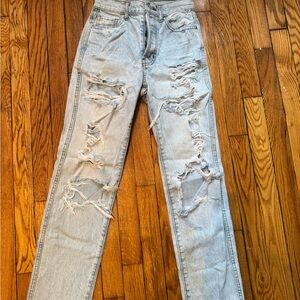 Distressed slight acid wash blue womens Jeans
